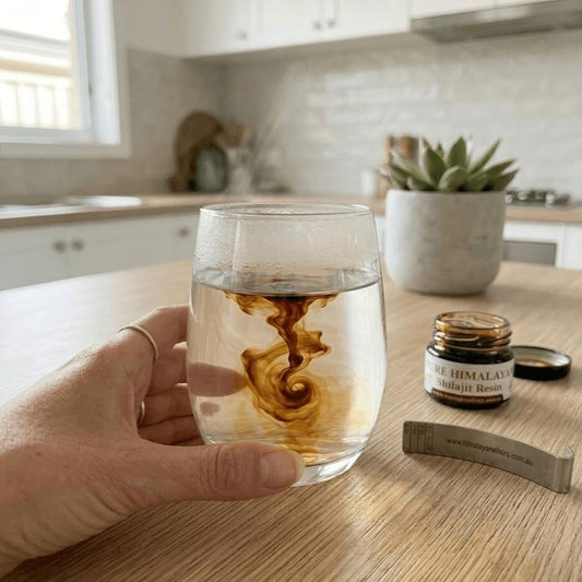 Pure Himalayan Shilajit resin dissolving in warm water, showing how to take shilajit resin the right way, by Himalayan Elixirs Australia.