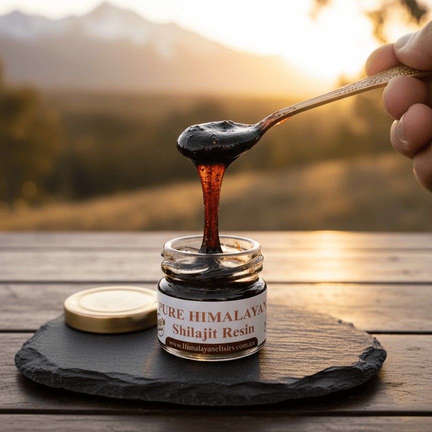 Pure Himalayan shilajit resin being scooped from a glass jar with an engraved steel spoon, showcasing the rich texture and artisan quality of Himalayan Elixirs' natural wellness superfood available in Australia