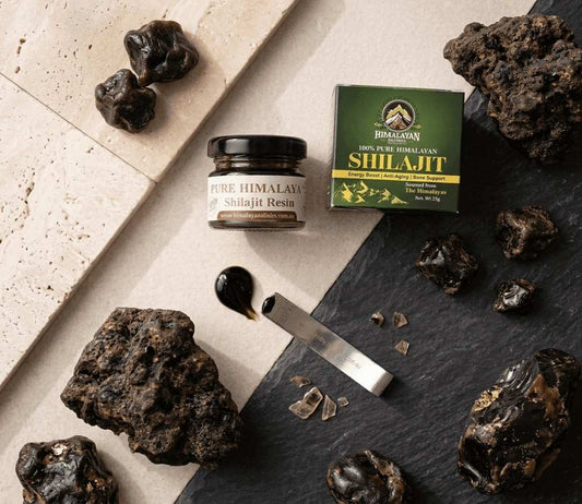 Top-down flatlay of pure Himalayan Shilajit resin in a transparent jar with a custom silver serving spoon by Himalayan Elixirs, featured in the 2026 shilajit side effects and safety guide for Australians.